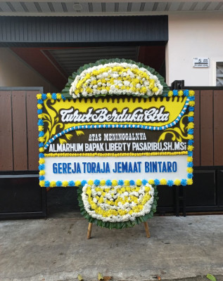 Papan Bunga Duka di Huamual
